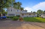 This stunning farmhouse colonial blends charm and functionality, offering endless possibilities for any lifestyle. A welcoming lemonade porch leads to a grand two-story foyer, with a convenient downstairs bedroom and half bath. The spacious eat-in kitchen features ample counter space, modern appliances, and a breakfast nook with French doors opening to the porch. The formal dining room connects to the living room with a cozy fireplace. Upstairs, the luxurious master suite boasts vaulted ceilings, a jacuzzi tub, and a walk-in closet, while two additional bedrooms, a full bath, and a laundry room complete the second floor. The expansive basement offers over 600 sq ft of space for customization, and a private two-bedroom, two-bath guest suite with its own entrance and driveway provides a perfect retreat. Located on a large lot with easy access to downtown Stony Pointâ€™s shops, marina, parks, and highways, this home is ideal for both comfort and convenience.