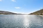 Welcome to the Lake! This 1 BR unit has beautiful lake views, washer/dryer in unit, utilities included, all with the convenient location at The Breezy! Steps away from the lake, as well as the restaurant and bar .  Lake living never was simpler! No smokers and no pets!