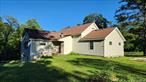 Sitting on over an acre of land is a 6 room, 2 bedroom, 2 bath home with a garage.