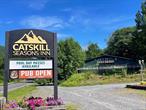 Exceptional investment opportunity in the heart of the Catskillsâ€”welcome to the Catskill Seasons Inn, a beautifully upgraded 22-room rustic hotel set on 60 scenic acres in Shandaken, just 2.5 hours from NYC and minutes from top ski resorts. This turnkey property features a 20-seat bar, event space for up to 70 guests, a swimming pool, tennis/basketball court, and an on-site two-bedroom managerâ€™s residence. Two lodging structures, including a chalet with suites and kitchenettes, are complemented by a three-bay maintenance facility. Recent capital improvements include a new NYDEP-compliant septic system (2025), propane tankless boilers, security system, modernized guest rooms, and enhanced landscaping. Approved subdivision plans and existing logging roads open the door to future expansion with cabins or campsites. With 2024 income exceeding $515K and consistent year-over-year growth, this is a rare chance to own a thriving hospitality asset with immediate returns and long-term development potential.