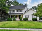 PRISTINE MONROE VILLAGE COLONIAL! This 4 Bedroom 4 Bathroom (3 full 1 half bath) with over 3000 sqft when including the finished lower level with walk out to almost a half an acre of level yard. The rocking chair front porch and two car attached garages on side, make this home picture perfect curb appeal. NEW ROOF in 2021, Central A/C 2023. Hardwood floors with custom inlays, custom lighting fixtures, Eat in Chefs kitchen with two ovens, gas range, stainless steel appliances and high end cabinetry with slow close features. Overlooking the sunken living room with gas fireplace. Formal dining room, formal living room and a half bath complete the main floor. Second floor offers a spacious primary bedroom with dedicated fully renovated primary full bath. Additional 3 bedrooms and hall full bath on second floor. Finished lower level with sliders to patio and private back yard. Laundry area, a possible 5th bedroom perfect for guests, recreation room and office in lower level is completed to the same finish as main parts of house. Monroe-Woodbury school district. Close to all shopping, schools, parks & Interstates.