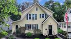 Welcome to 11 City Terrace North. Tucked away on one of the City of Newburgh&rsquo;s most unique, tree-lined neighborhoods right near Mount Saint Mary&rsquo;s College. Quality Craftsmanship in this Charming 1928 Home that could live like a 4-Bedroom. As you enter the Main Doorway, you are greeted by a cozy foyer with built-in storage and a special first floor layout. Restored Original Hardwood Floors + neutral paint colors welcome you in to the spacious main level. Old World Character blends seamlessly with convenient updates including: A Gorgeous Chef&rsquo;s Kitchen with Island + Breakfast Nook with mini-split and plenty of storage, Open-Concept Dining Room, Large Living Room with Brick Fireplace + Wood Burning Stove, Enclosed Bar Area with Built-ins, Laundry, Powder Room, Family Room + Bonus Room great for storage with Sliders out to the Back Patio. Main Level has a private entrance on the side of the home for a convenient separate living space. The second level features an updated Bathroom with Tiled Shower + Soaker Tub, a hall closet and 3 Bedrooms with a pull-down attic for abundant storage. A dry basement is currently being utilized for storage, a workshop and a home gym. A Private Driveway leads to a Detached Garage and fenced in yard. The back patio serves as a wonderful entertaining space. This house has so many updates + upgrades and is located in a storybook setting with commuter access to NYC. The Hudson Valley is bustling with wineries, farm-to-table restaurants, local shops, hiking and so much more. Come take a peek at a thoughtfully redesigned home that won&rsquo;t last long.
