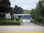 Presenting an inviting residence at 102 Putnam Road, Cortlandt Manor, NY. This charming home offers three bedrooms and one and a half bathrooms, providing a comfortable living space of approximately 1, 400 square feet. Situated on a generous 13, 251 square foot lot, this property combines convenience and tranquility.Upon entering, you&rsquo;ll appreciate the warmth of the hardwood floors that extend throughout the home. The living space is enhanced by central air conditioning, ensuring comfort during every season. The living room is bright and welcomingâ€”a perfect spot to unwind.The kitchen is both functional and stylish, with granite counters and stainless steel appliances. The eat-in kitchen design allows for casual dining, and the adjacent dining area features sliding doors that open to a delightful family room with a wood burning stove and access to a spacious backyard patio.Outdoor enthusiasts will enjoy the fenced-in yard, perfect for relaxation and entertaining. The attached 2 car garage, and driveway provides ample space for cars and storage.On the lower level, a partial basement offers additional utility with a recreation room and laundry area complete with washer/dryer. The home includes common outdoor space and pets are conditional, making it a versatile option for various lifestyles.Experience the serene park views from the comfort of your home while being conveniently located near a variety of shopping, dining, and recreational options. This home is currently unfurnished, inviting you to personalize the space to your taste.