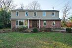 Spacious Colonial set back on a private one acre in the Village of Roslyn Harbor adjacent to the exclusive Engineers Country Club with unobstructed golf course views. Renovated kitchen and baths, large en-suite primary and finished lower level. Hardwood floors throughout.