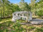 Nestled on a serene 1.81 acres of land with stunning views of Colabaugh Pond and just a short walk to the scenic Croton Reservoir. This charming raised ranch style home is surrounded by natural beauty, a true retreat for outdoor lovers and those seeking peace and quiet but also being just minutes from shopping, dining, and the Croton-Harmon Train Station.Step inside to find a bright and inviting living room, filled with natural light and warmth. The open layout flows effortlessly into the dining area and continues into a cozy, enclosed screened-in deck, ideal for morning coffee or evening relaxation with picturesque views all around. The kitchen features sleek stainless-steel appliances and a skylight, offering a bright and functional space. Nearby washer/dryer hookups and a side entrance add to the home&rsquo;s convenience. The main level includes a spacious primary suite with a private bath and generous closet space, along with two additional bedrooms and a full hallway bathroom. The finished walk-out lower level adds tremendous flexibility, featuring a fourth bedroom, a private office or den, a large family room perfect for entertaining, and another full bathroom. A one-car garage offers added storage, with ample parking available. Enjoy the best of both worlds, tranquil country living with easy access to major highways and an effortless NYC commute. This property offers space, comfort, and the peaceful lifestyle you&rsquo;ve been searching for.