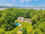 Welcome to 530 S Centre Island Rd, Centre Island â€” one of the most exclusive private islands for your vacation home.This massive center-hall brick Colonial sits on a 3-acre lot. Home improvements were completed in 2024. With 4, 685 sq. ft. of interior space, it provides 5 bedrooms (all 5 BR are en-suites), 6.5 baths, a formal dining room, family room, living room, office, sunroom, two-car garage, pool, and a detached 640 sq. ft. pool house for extra accommodations.The two-story entry foyer leads to exquisite craftsmanship throughout the entire home. Schedule your private tour today!