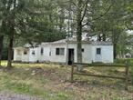 Calling All Investors, Contractors & Visionaries! Nestled in Wurtsboro Hills, this 3-bedroom, 2-bath cottage/bungalow is bursting with potential and waiting for the right buyer to bring it back to life. Set on a peaceful lot in a charming wooded setting, this major handyman special offers the perfect opportunity to restore or reimagine your dream getaway or year-round residence.Whether you&rsquo;re looking for your next flip, a personal project, or a rustic retreat to renovate, the possibilities are endless. Located just minutes from the Village of Wurtsboro, Route 17, and the natural beauty of the Catskills, this property is ideal for outdoor lovers and commuters alike.Please note: This home is being sold as-is and will require extensive repairs. Cash or rehab loan only.Donâ€™t miss your chance to invest in this hidden gem and create something truly special!
