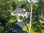 This extraordinary 5, 000 sq ft custom estate offers 6/7 bedrooms, 5 newly renovated full bathrooms, and an additional 1, 650 sq ft finished walk-out basement (not included in the square footage) with two Bedrooms, Den, Full Bath, Tile Plank Floors - Set up for luxurious everyday living and spectacular entertaining, this home is a true private retreat.Interior Highlights:â€¢ â€¢ Designer kitchen with Sub-Zero refrigerator with two Bosch Dish washersâ€¢ â€¢ Expansive loft overlooking the living roomâ€¢ â€¢ Gas fireplace in the living room; electric fireplace in the bar/sports roomâ€¢ â€¢ Inside sports room with theater seating, bar with seating for 10, and 3 mounted TVsâ€¢ â€¢ Beautiful hardwood floors throughout most of the first floorâ€¢ â€¢ Finished basement with new plank-style tile flooringâ€¢ â€¢ Central vacuum, full security & fire system, hi-hat lighting throughoutâ€¢ â€¢ 3-zone central air with oil heat (above ground tank)Outdoor Oasis:â€¢ â€¢ 18â€™ x 33â€™ Gunite pool with adjoining hot tub and waterfall. 1 year old Loop Lock Coverâ€¢ â€¢ Separate 6-person Jacuzzi hot tub under new 2-story Trex deck (725 sq ft) with PVC Railingsâ€¢ â€¢ Double-level 3, 120 sq ft Cambridge Pavers (Limestone Quarry Blend with Charcoal Edge) pool patio and entertainment areaâ€¢ â€¢ Cabana bar with Margaritaville theme, (separate structure) three 55â€ TVs, and seating for 8â€¢ â€¢ New Cambridge Pavers (Limestone Quarry Blend with Charcoal Edge) front stoop and walkwayâ€¢ â€¢ Freshly relandscaped grounds with 85-fixture landscape lighting system on timersâ€¢ â€¢ 3-car garage with epoxy flake flooringPremium Upgrades:â€¢ â€¢ New 3, 000 sq ft blacktop driveway with cobblestone edgesâ€¢ â€¢ New irrigation system with Wi-Fi controlâ€¢ â€¢ New T1-11 siding with black window trimâ€¢ â€¢ New 6â€ black gutter systemâ€¢ â€¢ Unfinished 950 sq ft basement storage area (separate from finished walkout)