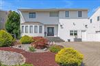 Majestic East Bay Waterfront Lands End 5BR Colonial w/Full Basement! Situated on a Wide Deep Water Canal w/SW Exposure! A RARE FIND! Open Floor Plan Oversized Backyard w/Trex Decking, Outdoor Kitchen, Pergola, Hot Tub, IG Pool, Bulkheaded w/Boat Lift (seller states Lift Holds up to a 32&rsquo; Boat).  LITE & BRITE & Inviting-- Stunning Waterviews! Huge Primary Suite w/Sitting Room! Bonus Home Office or 6th Bedroom w/Bath--Perfect for Nanny Quarters! O/S White Eat-in-Kitchen w/Open Floor Plan To Dining Room & Great Room w/Woodburning Fireplace--SUB ZERO--Wolf--Miele Appliances! Convenient Pantry & Utility! Whole House Generac Generator & Electric Car Station Hookup, 2-Zone CAC, Most New Windows, 200AMP, Newer Vinyl Siding & Roof! Live Your Best Life! Vacation All Year Round!