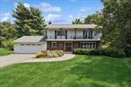 Welcome to this beautiful colonial-style home in the desirable Scenic Hills neighborhood, located within the sought-after Arlington School District. This spacious and updated home offers a functional layout, perfect for modern living.The main level features a sun-filled living and dining area, along with an updated eat-in kitchen thatâ€™s a chefâ€™s dreamâ€”complete with stainless steel appliances, an instant hot water tap, and a touchless faucet. The cozy family room includes crown molding, a wood-burning fireplace, and direct access to the deck overlooking the expansive backyard. A convenient half bath and laundry room complete the first floor. Upstairs, youâ€™ll find four generously sized bedrooms, all with hardwood floors and ample closet space. The primary suite includes a walk-in closet and a recently renovated en-suite bathroom. The second bedroom also features a walk-in closet and French doors that open to a front balcony. Two additional bedrooms and a remodeled full hall bath complete the upper level.The partially finished walkout basement offers flexible space for a playroom, home gym, craft room, or entertainment area. Outside, the private, tree-lined backyard features a beautiful stone patioâ€”ideal for relaxing, entertaining, or enjoying the outdoors. This home offers the perfect blend of comfort and convenience, close to major highways, shopping, healthcare facilities, and schools.