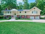 An exceptional opportunity in one of Huntingtonâ€™s most sought-after neighborhoods. This expanded high ranch provides approximately 4, 000 sq ft of thoughtfully designed living space, with a flexible layout that has strong potential for a mother-daughter setup with proper permits.The kitchen and two of the 3.5 bathrooms were tastefully renovated in 2022 with a clean, modern finish. There are five spacious bedrooms and multiple bonus rooms on the lower level â€” ideal for a home office, gym, guest area, or additional storage â€” plus a large laundry area and half bath.Comfort is enhanced by central air conditioning (two zones) and a three-zone heating system. Original hardwood floors run through much of the main level, adding warmth and character.Set back from the road, the property features a dual-entry driveway for convenient drive-through access, a two-car garage with automated doors, and additional parking for three vehicles. The backyard is flat, open, and easy to maintain.Located minutes from Huntington Village, with its renowned restaurants, boutique shops, cultural events at The Paramount, seasonal farmers markets, and scenic Heckscher Park. Nearby beaches such as Crescent Beach and Fleets Cove Beach, as well as local marinas and golf courses, round out a lifestyle rich in convenience and recreation.This is truly a must-see home for those seeking space, flexibility, convenience, and long-term value.