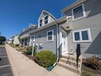 Welcome to this well-maintained condo within walking distance to all the charming amenities Pine Bush has to offer, including restaurants, shops, and more. The main level features a bright kitchen with tile flooring, a spacious living room with brand-new wood floors, and sliders leading to a private deckâ€”perfect for relaxing or entertaining. Freshly painted throughout, the first floor also includes a convenient half bath.Upstairs, youâ€™ll find a primary bedroom, an additional room ideal for a den or home office, and a full bath with a tile shower. The second floor also offers the convenience of a laundry room and brand-new carpet throughout. Recent updates include new wood floors (1 week old), carpet (2 days old). A full unfinished basement provides plenty of storage or potential future living space. Pine Bush School District