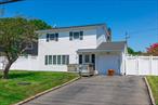 Charming Colonial-style home with 4 bedrooms and 2 full baths in the heart of Patchogue. Spacious living and dining areas, perfect for gatherings. Large fenced backyard offers privacy and room to create your ideal outdoor space. Located just minutes from the water, parks, and vibrant downtown Patchogue with shops, dining, and entertainment. Low taxes and plenty of potentialâ€”bring your vision and make this home your own!