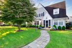 Perfectly situated midblock in the sought-after Cathedral Gardens section of West Hempstead with West Hempstead schools, this storybook colonial has been meticulously maintained and thoughtfully renovated with an updated kitchen, bath, basement, new central AC, and water heater. The first floor offers a classic center hall layout with an oversized formal living room featuring a wood-burning fireplace, and an open-concept formal dining room with French doors leading to a private, fenced-in yard. Upstairs boasts three spacious bedrooms and an oversized full bath with both a separate shower and a soaking tub, while the updated basement provides a versatile play space and additional storage. A pull-down attic, two-car garage, and proximity to Garden City Village, major highways, and shopping complete this charming and move-in ready home.