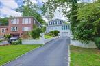 Welcome to 195-12 McLaughlin Avenue Holliswood, NY 11423, a rare find in one of Queensâ€™ most coveted and elevated residential enclaves. This three-story detached home sits proudly offering a unique combination of space, views, and untapped architectural expansion and customization. With 4 spacious bedrooms, 2.5 baths, a pull down attic staircase, a finished walk out basement, and a private attached garage, leading to a spacious walk out driveway that can accommodate several cars as well as an expansive private backyard this home is awaiting your personal vision and imagination. The second floor landing has 3 bedrooms, 1 full bath as well as multiple closets. The first floor has 1 bedroom, powder room, laundry room with washer and dryer.Whether you&rsquo;re envisioning a full modernization or a strategic extension to maximize square footage and value, this property invites bold creativity. Add a sunroom, expand the kitchen, elevate the curb appeal with a new fa&#231;adeâ€”the possibilities are endless.Inside, you&rsquo;ll find a welcoming foyer, a formal living room, an elegant dining room, a mudroom, and ample closet spaceâ€”a classic layout perfect for modern reimagining. The finished basement offers the flexibility for a guest suite, home office, gym, or entertainment space and a huge cedar closet..Located in an upscale, serene and secured community known for its well-maintained homes, tree-lined streets, and a strong sense of neighborhood pride, this property offers both tranquility and convenience. Enjoy hilltop views, natural light throughout, and a sense of privacy thatâ€™s hard to find in the city.The zoning permits extension up to 0.5 FAR on this 4356 square foot that offers the potential to customize to your desire to make this home your dream mansion.Neighborhood Highlights: â€¢ Just minutes to St. Johnâ€™s University, York College, and Queens Collegeâ€¢ Located in Holliswood, Jamaica - Estates. â€¢ Easy access to Grand Central Parkway, Cross Island Parkway, and public transportation (buses and LIRR)â€¢ Near Union Turnpike shopping corridor, gourmet groceries, fine dining, several parks, and top-rated District 26 schools.â€¢ Short drive to LGA & JFK Airports and LIJ & North Shore Hospitalâ€¢ Multiple Houses of various WorshipDistrict 26 Zoned Schools:â€¢ PS 178 Holliswood Schoolâ€¢ IS 216 Ryan JHSWhether you&rsquo;re an end-user ready to create your dream home or an investor seeking value in a prime high-demand area, 195-12 McLaughlin Ave Holliswood Queens, NY offers the best of both worldsâ€”solid bones and extraordinary potential.