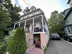 Classic Colonial Home in the Heart of Historic NyackThis early 20th-century Colonial, rich in period detail and charm, sits proudly on a picturesque street lined with timeless architecture. Featuring a gracious wraparound porch and classic design, the property has been thoughtfully converted into a legal 4-family residence, offering flexibility for investors or those dreaming of restoring a true single-family gem.Each of the four one-bedroom apartments occupies its own levelâ€”floors 1 through 3, plus a walk-out lower levelâ€”making it ideal for rental income or multigenerational living. Whether you choose to maintain its current configuration or restore it to its original grandeur as a single-family home, the possibilities are inspiring.Located just a short stroll from the heart of town, this home offers unparalleled access to Nyack&rsquo;s vibrant village life. Enjoy dining, shopping, parks, and cultural spots, all within walking distance. Nature lovers will appreciate the nearby Old Rail Trail, which stretches for miles into New Jersey, and the community amenities like tennis courts, gardens, and the scenic Hudson River waterfront.Nyack is one of the last places in the county that still captures the feeling of a classic, old-fashioned villageâ€”rich with history, community, and charm. This is your chance to be part of it.