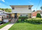 Welcome to this stunning 2-Story home in Bayside, where charm meets modern comfort in one of Queens&rsquo; most desirable neighborhoods. This meticulously maintained 4-bedroom, 2.5 bathrooms residence sits on a 50x60 lot, offering 1, 488 square feet of thoughtfully designed living space, including a fully finished basement with a separate entrance and full bathroom. The heart of this home features a tastefully updated eat-in kitchen with stone countertops, stainless steel appliances, and a breakfast bar that opens to a spacious dining area, as well as a formal dining room, creating a seamless flow for entertaining. Rich hardwood floors throughout complement the elegant crown molding and recessed lighting, creating a refined and welcoming atmosphere. The main level features a first-floor bedroom with a convenient half bathroom, while the second floor offers three additional bedrooms and a full bathroom. Efficient split AC units and gas heat ensure year-round comfort. With features including a covered front porch, a one-car attached garage with a covered driveway, this property offers the perfect blend of privacy and space. Located just a few short blocks from Cunningham Park&rsquo;s walking trails and green spaces, and a short walk to top-rated District 26 Schools.