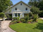 Restored Historic Carriage House with Guest Cottage in Prestigious Cove Neck.Tucked away in the exclusive historic enclave of Cove Neck, this beautifully restored carriage house blends original pre-war charm with modern comforts. Set well back from the road on 4 serene acres of rolling lawns, mature trees, and lush plantings, a long pebbled driveway creates a sense of arrival.Inside, elegant proportions and high ceilings enhance the homeâ€™s timeless appeal. The gracious living room features a wood-burning fireplace, while the expansive formal dining roomâ€”also with a fireplaceâ€”sets the stage for memorable gatherings. A warm and inviting library with built-in bookshelves and fireplace offers a quiet retreat, and the private office/den provides the perfect space for working from home.The chefâ€™s kitchen is a true centerpiece, boasting stainless steel appliances, a massive center island with seating, and a convenient pass-through pantry for additional storage and prep spaceUpstairs, the luxurious primary suite offers a private balcony and a spa-inspired en-suite bath with soaking tub and separate shower. Four additional bedrooms and three full bathrooms provide ample accommodations, complemented by a second-floor laundry room for added convenience.In addition to the main residence, a separate 3-bedroom guest cottage offers privacy and flexibility for visitors, and extended family. A detached 3-car garage with generous storage space adds further functionality and convenience.This rare property combines the elegance of a bygone era with the lifestyle amenities todayâ€™s buyers seekâ€”all in one of the North Shoreâ€™s most sought-after settings.