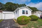 Welcome to this beautiful fully renovated 2 bedroom, 2 full bath ranch-style home in The Greenwood Village Community. This is a gated 55 and over community with tons of amenities. There is a club house, fitness center, gym, shuffleboard, pickleball courts, bocci ball, billard room, and activities galore. This newly renovated one-level unit offers a spacious open floor plan. This home features new roof, new siding, new windows, new kitchen and appliances, laminate wood floors, new bathrooms, new washer and dryer, new electric, new ductless heating and cooling, In addition there is an enclosed attached sunroom which leads to a private yard and an attached one car garage. Too much to list. Please note that Greenwood Village is a Cash Only community and an application approval is required.