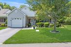 Welcome Home! This much sought after AUGUSTA model in an end unit in desirable Sunken Pond Estates, a 55+ gated community. Front porch has a direct view of the pond.Single level living with 2 bedrooms, 2 bathrooms, ample closets and storage space, washer and dryer and attached 1-car garage with pull down stairs to overhead storage Vaulted ceilings in the spacious , light filled living room with a 3-sided fireplace. Dining room has sliders to the back patio that is paved with brickwork.Sunken Pond Estates is conveniently located to restaurants, shopping, medical facilities, golf courses, wineries and breweries and all the North Fork has to offer.