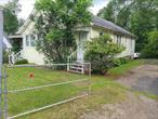 Country cottage set on a private quarter acre that is fenced off just outside of Loch Sheldrake NY. House just recently updated electric panel and service to 200 amp. 2 bedrooms with 2 full bathrooms along with a bonus room with separate entrance that can be used as 3rd bedroom. Full basment with walkout access great for storage. Exterior of home in good shape interior needs updating.