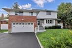 Welcome to this brand new renovated home in Clearview Village, Syosset. Experience the elegance of this completely renovated, beautifully crafted home featuring 6 spacious bedrooms and 5 full bathrooms, thoughtfully designed for comfort, style, and modern living. Step inside to discover an open-concept living and dining area complemented by a chefâ€™s kitchen with premium finishes and generous cabinets. Elegant custom moldings and brand-new oak wood flooring add warmth and sophistication throughout. From the dining room, sliding doors open to a huge deckâ€”perfect for family and friends get togethers. The second floor boasts a primary bedroom suite with a full bathroom, along with two additional generous bedrooms and a full bath. The third floor offers two more bedrooms and another full bath, while the lower level provides a private bedroom and bathâ€”ideal for guests or extended family. Additional highlights include a finished basement, a two-car garage with an epoxy floor, 200-amp electrical service, new central air conditioning and heating system, an architectural roof, energy-efficient Andersen windows and and a fully fenced white vinyl backyard. Move-in ready and thoughtfully upgraded, this stunning residence seamlessly combines modern amenities with functional living space. Waiting for you to move in and enjoy!