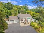 Welcome to this beautifully renovated 2 Bedroom, 2 Bathroom home situated on an expansive 1.8-acre lot in Dix Hills with very low taxes. Located in the highly regarded Half Hollow Hills School District, this property combines comfort, flexibility, and tremendous potential. Inside, you&rsquo;ll find a bright and updated interior with an open-concept layout, spacious living areas, and two generously sized bedrooms. The full finished basement with its own separate exterior entrance offers a versatile space, perfect for a home office, guest area, recreation room, or extended living. Central AC cools the home on hot summer days.Outdoors, the property truly shines. Enjoy your private, park-like setting complete with a large 2 car garage, two storage sheds, and plenty of open space for outdoor activities or future development. Whether you&rsquo;re looking for a move in ready home or envisioning a custom expansion, this property is ideal for an owner occupant or someone looking to build onto the existing structure.Conveniently located near major roadways, shopping, and recreational amenities, this is a rare opportunity to own a slice of serenity in one of Long Islandâ€™s most desirable neighborhoods!