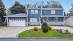 Incredible Opportunity in the Village of Lindenhurst!Fully paved circular driveway offers tons of parking space Boasting impressive curb appeal, this home features a fully paved circular driveway with tons of parking space and is enhanced by a beautifully landscaped center. The exterior is a blend of durable vinyl and stone siding, offering both style and low-maintenance appeal. A spacious two-car garage provides ample storage and parking space, making this home both practical and inviting from the moment you arrive.This spacious home offers an open-concept layout with tons of space in the oversized rooms perfect for comfortable living. The first floor features a bright and airy living room with a cozy fireplace, flowing seamlessly into the updated kitchen with stainless steel appliances, a massive center island, beautiful granite countertops, and abundant cabinet and countertop space. A formal dining room with sliding glass doors leads to the backyard, offering large windows that let in plenty of natural light.French doors open into a large sunken den with direct access to the two-car garage. The first floor also boasts a primary bedroom with a full bath and walk-in closet, an additional bedroom, and a main full bath.Upstairs, youâ€™ll find three generously-sized bedrooms, a second living room, and another updated full bath. The bedroom at the end of the hall features sliding glass doors leading to a private deck, with the added convenience of a washer and dryer on the second floor.The full unfinished basement includes an outside entrance and utilities. With two electric meters and two gas meters, this home offers added flexibility.The yard is perfect for entertaining and is fully fenced with white Vinyl. Large patio, shed and 2 story deck to upstairs bedroom. Gas Heat, Central AC.Donâ€™t miss this fantastic opportunity to own a large, well-maintained home in the sought-after Village of Lindenhurst!
