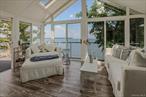 The allure of coastal living is calling you! Welcome to 27 Shore Drive, a 3 bedroom, 3 bathroom waterfront retreat situated along a peaceful stretch of Huntington Bay&rsquo;s coastline, offering breathtaking views of Lloyd Neck, Eatonâ€™s Neck, and beyond to Connecticut. Whether you&rsquo;re fishing, paddle boarding, or simply savoring the serenity, 27 Shore Drive is your slice of heaven in Huntington Bay. Enter through a welcoming foyer that leads to the great room, the homeâ€™s main attraction, where your eyes are drawn to a wall of windows showcasing panoramic vistas of the bay, your dipping pool and the relaxing outdoor living spaces. The chefâ€™s kitchen boasts a Quartz center island and stainless-steel appliances, perfect for both casual meals and elaborate dining experiences. There is a perfect dining area and a versatile space that can serve as a den, office or 4th bedroom. You will also find a full bathroom and a convenient storage room on this level. Upstairs, the primary suite is a sanctuary of luxury with vaulted ceilings, a spa-inspired bathroom, a walk-in closet, and a sun-filled sitting room framed by three walls of windows overlooking Huntington Bay and Long Island Sound in the distance. Two additional bedrooms and a full bathroom complete this level. Step outside to embrace the quintessential waterfront lifestyle. The property offers exclusive beachfront access and a large paver patio complemented by a dipping pool and outdoor shower. The yard is perfect for outdoor dining and relaxation. Enjoy sun-soaked afternoons and sunset dinners. Enjoy quiet time in the side yard bistro area.  Enjoy being a part of Bay Hills Private Beach Association (fee) with tennis, pickle and basketball courts, a camp and a very active list of community events! New roof, siding, and burner (2020), bathrooms (2018), whole house generator, and so much more. True taxes including Village of Huntington Bay $18, 728.