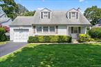 New to Market! Welcome to this beautifully maintained home in the Garden City school district in a mid block location. It is a four bedroom, two full bath expanded cape on 60x125 property. On the first floor this home offers a large living room, formal dining room, a bedroom, full bath, den, washer/dryer and eat in kitchen connected to a three season sun porch. On the second floor is a spacious primary bedroom plus two additional bedrooms and a full hall bath. The basement is partially finished and awaiting your personal touches. The yard is expansive and open with a paved patio. The property is fully landscaped with mature plantings and completely fenced. There is an attached, one car garage. Gas heat, updated mechanicals, window/wall ac units. This home is ready for you to make it yours!