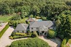 Welcome to 294 Half Hollow Hill Road, a stunning brick colonial perfectly situated on a serene 2.8-acre property in the heart of Dix Hills. Featuring 5 bedrooms and 4 full baths, this residence blends timeless elegance with exceptional comfort. Step inside to find floor-to-ceiling windows that bathe the home in natural light, a spacious primary suite with fireplace, large closets, and a luxurious en suite bath. The oversized two-car garage offers ample space, and the full basement provides endless possibilities for storage or finishing. Outdoors, enjoy your own private retreat: an outdoor pavilion with a pizza oven, barbecue, full bath, and storage area, all overlooking a sparkling gunite pool. Beautiful landscaping and mature trees create exceptional privacy, while a private cul-de-sac entrance adds exclusivity.This home is perfect for both entertaining and quiet escapes â€” a rare opportunity in a sought-after location.