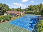 Mid-century modern style meets endless fun in this 4 bedroom (but lives like a 5 bedroom), 3 full bath Town of Lagrange beauty set on 1.6 acres of private, park-like grounds. Serve, smash, or shoot on your very own, freshly painted TENNIS/PICKLEBALL/BASKETBALL COURT - complete with lights for nighttime play - then unwind around the fire pit as the sun sets. Inside, sunlight pours through expansive windows into the living room, where a fireplace adds warmth and charm, flowing seamlessly into the open dining area. Gleaming hardwood floors run throughout, adding timeless elegance and easy maintenance. The large kitchen is a chefâ€™s delight with a bay window, convenient island, abundant recessed lighting, generous counter space, and extensive cabinetry. Nicely sized bedrooms offer comfort for family and guests, while a beautiful three-season porch blurs the line between indoors and out, inviting relaxation from morning coffee to evening cocktails. The spacious, partially finished basement is ready for a home office, gym, game room or all three! The possibilities are ENDLESS!! Updates youâ€™ll love: most windows (2016), well pump and water softener (2019), new furnace and AC (2022), and roof (2023). Complete with a two-car garage, this entertainerâ€™s dream home is where style, comfort, and recreation come together. Located just minutes to the Taconic State Parkway, several beautiful parks and the Dutchess Rail Trail. Donâ€™t miss this one of a kind home!!