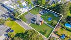 Rare multi-parcel property with development potential and subdivision opportunities. This property is set on three separate parcels, each lot with their own tax id. Offering unmatched flexibility for homeowners, builders, or investors. With the proper process and approvals, the site can be subdivided to create an additional buildable lot perfect for constructing a brand-new home while keeping the existing residence. Total of all 3 lots is approximately .44 acres. or 150 X 128.26 sq ft. The current home blends charm and space, featuring a sunlit living room with hardwood floors, a cozy wood-burning stove, and sliding doors opening to the backyard. The kitchen offers plenty of storage and prep space, while the homeâ€™s multiple bedrooms provide comfort for everyday living. Outdoors, enjoy expansive grounds with a detached garage, above-ground pool, and plenty of room for entertaining, gardening, or future expansion. Located in a convenient area close to shopping, dining, schools, and transportation, this property combines immediate livability with long-term investment upside. Whether you want to move in, rent out, or develop, opportunities like this are rare, make it yours!