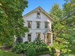 Fall in love with this impeccably renovated 1882 East Williston Estate featuring 4 bedrooms, 4.5 baths, a fully restored barn, perfect for work, play or relaxation and a stunning heated Gunite pool all set on .70 beautifully landscaped acres blends timeless elegance with luxurious modern updates. From original woodwork and designer finishes to a gourmet kitchen to the radiant-heated floors in the primary bath, every detail has been thoughtfully curated. Entertain in style with full outdoor setup, firepit, Sonos system and more. This is a rare blend of elegance, comfort, convenience - minutes from dining, parks, and transit. Entry through the period-perfect replication of the original double oak doors leads into the gracious foyer with original staircase that features the hand-carved newel post and curved banister. The sun-flooded living room features period details such as plaster moldings and medallions, intricate in-laid mahogany & oak floors. The living room is open to the dining room, where the bay window features a window seat. Enter the heart of the home, the chefâ€™s kitchen, which encompasses the entire rear of the house. The large and well thought out mudroom features a huge coat closet, radiant heated tile flooring, hooks for backpacks, bench seat and lots of shelving for quick access to all day-to-day necessities. The convenient side entry door is off the car park portion of the driveway giving everyone an organized start to the day. There is a beautiful breakfast room with a wall of cabinetry with wine/beverage fridge, pullout storage drawers and a wall of windows that include sliding doors to the brick patio giving you a tranquil view of the gorgeous property. The kitchen island features one (of two dishwashers), a prep sink, two beverage drawers, seating and storage. There are two ovens, warming drawer, Sub-Zero refrigerator/freezer, 5-burner gas cooktop, hood vent, glass tile backsplash, and exceptional amount of gorgeous custom wood cabinetry. Off the kitchen and tucked away is a relaxing library with gas fireplace, wall of shelving and cabinets and the door to the lower level. Additionally on this floor is a half-bath, pantry closet. The bedroom level has an extra ordinary primary suite. The expansive bedroom, easily holds a California king, seating area and dressers. There are two fitted walk-in closets and a spa-like bath with soaking tub, separate shower, toilet and two separate vanities. The additional bedrooms are nicely sized, and features include double closets, bay window, and inlaid flooring. Completing this floor is a laundry room and full bath. Up to the finished attic with a very versatile layout that could accommodate additional two bedrooms, extensive home office,  or huge playroom and there is storage galore! The partially finished basement features an additional laundry room with LG washer and dryer and utilities, playroom and a suite with full bath with outside entrance and separate ductless air conditioning. The private property is a delight with a resort-like setting for relaxing. There is a brick patio, with Sonos speakers, multiple seating areas and is adjacent to the fenced, heated, Gunite 42 x 20 inground pool with brick deck. Also there is a dedicated seating area with fire pit and a renovated barn with partial kitchen, bath and second floor entertaining loft-like space that has the vibe of an Adirondack cabin in the woods. Attached to the barn in a tandem, oversized two-car garage with storage and there is an additional storage shed. Additional features include Sub-Zero & Wolf Appliances, 2 dishwashers, Schmacher & Philip Jeffries wallpaper, Dodds & Eder landscaping,  radiant-heated floors, NEW HVAC systems, boiler, whole house humidifierThis home has been impeccably designed and the flawless execution of the design by professional artisans is evident throughout this perfect blending of old and new.