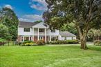 Welcome to this spacious and beautifully updated 5 bed/4 bath center hall Colonial on a flat and cleared 1 acre in Dix Hills/Half Hollow Hills School District.From the minute you enter the large foyer with 2 closets, you will be greeted by the perfectly laid out floorplan. The white kitchen is a chefs delight, with a large quartz center island leading out to the expansive rear yard.The main floor also features a versatile guest suite and a family room with walls of glass and cozy fireplace. Large rooms throughout.Upstairs you will find 4 generously sized bedrooms and an owners suite with walk in closet , dressing area and ensuite full bathroom.Numerous updates include, 200 amp electric, 3 year old burner and hot water heater and central air condenser for comfort and efficiency. Enjoy the outdoors with professionally landscaped grounds and a large Trex deck that overlooks the expansive 1 Acre property.