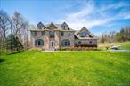 **Welcome to 11 Saddle Hill Road â€“ A Perfect Blend of Luxury, Space & Location**This stunning brick Colonial offers the perfect balance of private luxury and everyday convenience. With over **5, 000 square feet** of impeccably finished living space, this home provides ample room for everyone to **live, work, and relax in comfort**.Step into the **grand two-story foyer**, flooded with natural light and featuring **gleaming hardwood floors** that flow throughout the home. The main level boasts a **formal dining room**, a versatile **home office or flex space** with elegant French doors, and a spacious, updated **family room** that seamlessly connects to the **eat-in kitchen**â€”complete with **granite countertops** and **top-of-the-line LG appliances**.Just off the kitchen, youâ€™ll find a **full bathroom**, a **private laundry room**, and access to the **oversized two-car garage**.Upstairs, unwind in the **expansive ownerâ€™s suite** featuring a **luxuriously updated bath** with a **standalone soaking tub** and tranquil views of nature. Three additional bedrooms offer **generous closets** and **hardwood floors**, while a second **updated full bath** completes the upper level.The **fully finished lower level** includes a **bonus room**, another **updated full bathroom**, and **walk-out access** to the **newly enhanced backyard patio**â€”perfect for entertaining or relaxing outdoors.Built in **2006** and set on **over 2 acres of flat, private land**, this home offers the space and serenity you desire, just minutes from **shopping, schools, public transit, hiking trails, lakes**, and more.