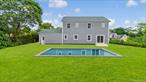 Exquisite New Construction in Hampton Bays!! Tucked away on a quiet, private drive, shared with just a few neighbors south of Montauk Highway, this Newly Built 4-bedroom, 2.5-bath Residence blends timeless Hamptons style with exceptional craftsmanship. A covered mahogany porch leads into a dramatic grand entry with soaring 9 foot vaulted ceilings, setting the stage for light-filled, elegant interiors. Solid, wide-plank, white oak floors flow seamlessly throughout the first and second levels, paired with solid wood doors and custom-finished closets, three of which are in the Primary Suite, one being a large walk-in. The open-concept living area centers on a chefâ€™s kitchen with quartz countertops, stainless steel appliances, and a generous center island, perfect for both casual dining and entertaining. The finished, sheetrocked, 2-car garage with 10.5 foot ceilings and remote controlled doors, adds function and style, while the expansive lower level, with high ceilings just shy of 8.5 feet, two egress windows, and a walk-out to the backyard, offers a large open canvas for future possibilities. Outdoors, enjoy a private backyard with mature 20 foot plus arborvitae trees, a 16 x 32 inground pool, and plenty of room to expand! Mahogany decking at the front and rear, covered in the front, creates inviting spaces to relax and entertain. This grand Residence lies just a stoneâ€™s throw away from plentiful shops, schools, transportation, world-class beaches and fishing, as well as top-rated waterfront restaurants, which Hampton Bays is renowned for!! Enjoy refined living in the heart of Hampton Bays today! Other models available as well.