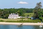 A singular opportunity to acquire 22.20 contiguous acres on the Peconic Bay, offering 470 feet of premier bayfront and a private sandy beach. More than 10 acres are planted with mature vines producing an impressive range of grape varietals, including Pinot Noir, Merlot, Cabernet Franc, Malbec, Petit Verdot, Sauvignon Blanc, Chardonnay, and Gruner Veltliner. Development rights are intact, allowing for future potential.At the southern edge, a 4, 200 sq. ft. waterfront residence captures sweeping bay views, while the northern boundary along Main Road features a 2, 500 sq. ft. home. The north section also includes a series of barns and farm buildings, providing ample agricultural and operational versatility.Zoned R-80 with an Agricultural District exception, this property allows for large-lot residential zoning with the flexibility of active agricultural use. R-80 zoning is intended to preserve Southold Townâ€™s rural character by maintaining spacious residential living and open land. The agricultural exception designation allows for expanded farm operations, including, but not limited to, processing and direct sale of farm products such as wine, jams, baked goods, and crops. In addition, the property offers residential subdivision possibilities, further enhancing its long-term value and potential.This incredible waterfront acreage, steeped in North Fork history, is ready for its next steward.