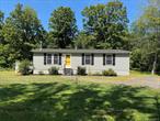 Beautifully maintained 3-bedroom, 2-bath manufactured ranch home with an inviting fireplace and open floor plan. Situated on 1.28 acres in a peaceful country setting, the property provides a sense of privacy while still being conveniently close to skiing, hiking, shopping, and local amenities. Experience year-round enjoyment surrounded by natural beauty.