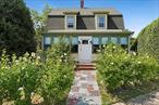 Own a Rare Piece of Greenportâ€™s Main Street History- Step into The Hommel House, a 3 bedroom cherished Greenport landmark built in 1903. This Craftsman beauty retains all of its original characterâ€”warm wood details, inviting light-filled rooms, and a sense of timeless graceâ€”while offering thoughtful updates for todayâ€™s lifestyle. A welcoming cookâ€™s kitchen sits at the heart of the home, and the newly refreshed primary bath echoes the original 1903 style, complete with a clawfoot tub. Lush plantings of Privet and Rose of Sharon create a sense of seclusion, making you forget youâ€™re right in the heart of Main Street. In summer, enjoy your morning coffee from the screened-in front porch as the sun rises, and savor the evening glow watching the sunset from the private back courtyard. Cool off in the outdoor shower after the beach, and work from home in an amazing outbuilding set up as an office/yoga studio. Rich in charm, history, and heart, this happy home is ready to welcome its next chapter.