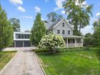 Timeless Elegance Meets Modern Luxury in Ridgefield, CT. Nestled on a beautifully landscaped 0.86-acre lot in southern Ridgefield, just minutes from the heart of the village, this masterfully restored 3-bedroom, 5.5-bath residence blends the warmth of 19th-century charm with the sophistication of contemporary living. Originally built in 1900, the home has been thoughtfully updated to showcase enduring craftsmanship alongside high-end modern finishes. At the heart of the home is a stunning transitional-style gourmet kitchen, complete with a spacious center island, custom cabinetry, a walk-in pantry, and a casual dining area, ideal for everyday living and entertaining. A formal dining room provides an elegant setting for gatherings, while the inviting living/family room is complemented by a convenient powder room. A main-level laundry room enhances the home&rsquo;s seamless and functional layout. Upstairs, the luxurious primary suite offers a peaceful retreat, featuring a generous walk-in closet with custom built-ins and a spa-inspired bath with a soaking tub and oversized shower. Two additional en-suite bedrooms each include their own walk-in closets, providing comfort and privacy. The third floor expands the home&rsquo;s versatility with a flexible layout, including a dedicated office or study nook and a bonus room perfect for crafts, hobbies, or an additional workspace, complete with built-ins. Step outside to experience year-round beauty in the professionally designed gardens Manicured lawns, mature flowering trees, and serene outdoor living spaces create an idyllic setting. Above the detached garage, a private studio with a full bath offers endless possibilities-ideal as a home gym, creative studio, or secluded office. Combining historic New England charm with contemporary comfort, this exceptional property is located just one hour from New York City and moments from Ridgefield&rsquo;s Main Street, renowned schools, fine dining, and cultural attractions. A rare opportunity to enjoy timeless character, modern convenience, and a true sense of retreat, all in one extraordinary home.