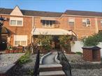 Welcome to this charming single family brick townhouse in Middle Village with 1 car garage, located only 1 block to Juniper Park. The first level features a large and sunny Living Room and Dining Room, an Updated Kitchen, a bonus room over the garage. The second level offers 2 spacious bedrooms, and a full bathroom. The lower level is a perfect recreation room with a bath, and laundry area. This home offers private rear parking for one car in the convenient garage. There are plenty of closets,  Anderson windows, Hardwood floors throughout and a natural gas heating system. Ideally situated near shopping, restaurants, highly rated schools, and popular Juniper Park (tennis, pickleball and bocce courts, track, basketball and baseball fields). This home is easily accessible to local and express buses, M and R subway, and Queens Center Mall. This move-in-ready home is the perfect opportunity to design your own living space and is ready for your creative touches. Call today for an appointment!