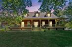 Welcome home to this beautifully crafted Cape Codâ€“style farmhouse, perfectly situated on 1.9 scenic acres in the Marlboro School District. Designed for comfort and versatility, this expansive home features hardwood floors throughout the first and second levels, and offers 5 bedrooms and 5 full bathrooms, including a first-floor bedroom with an ADA-compliant bath - ideal for multigenerational living. The main level showcases a formal dining room, a spacious eat-in kitchen with granite countertops, and a sunlit living room highlighted by a dramatic floor-to-ceiling stone fireplace, creating a cozy yet striking focal point. Skylights flood the space with natural light, and a convenient laundry room located just off the kitchen adds everyday ease. Upstairs, youâ€™ll find two primary suites, each offering privacy and comfort. Additional space includes guest quarters above the garage and a fully finished basement with a second laundry area, perfect for extended family, visitors, or a flexible home setup. Step outside to enjoy your own private backyard retreat, complete with an in-ground heated pool, spacious deck, and plenty of open yard space - ideal for entertaining or peaceful relaxation. This thoughtfully designed home combines classic charm with modern function. Donâ€™t miss this opportunity to make it yours!