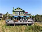 Experience the ultimate oceanfront living with this stunning, updated year-round home in Atlantique. Completely rebuilt from the ground up in 2010 using only the highest quality materials. Nestled on a rare and oversized 160 x 80 lot, this home boasts breathtaking panoramic ocean views and unparalleled seclusion. With the ocean to the south and the National Seashore to the east, youâ€™ll enjoy unmatched privacy and a true sense of escape. Whether youâ€™re seeking a peaceful retreat or a luxurious forever home, this property delivers it all.Enjoy stunning sunsets from your private oceanfront deck â€” a view that will never get old. This home is designed to maximize the connection between indoor and outdoor living, with multiple mahogany decks throughout, inviting you to embrace the tranquil beauty of the ocean and the surrounding landscape. Take your outdoor living experience to the next level with a crowâ€™s nest landing roof deck offering 360-degree views of the bay and ocean. It&rsquo;s the perfect spot for stargazing, watching the sunset, or simply soaking in the beauty of your surroundings.The thoughtfully landscaped outdoor space creates a serene garden oasis, ideal for relaxing. After a day at the beach, rinse off in the outdoor shower or unwind in the private hot tub, surrounded by lush nature.The heart of the home is the chefâ€™s kitchen, featuring top-of-the-line appliances, ample counter space, and a spacious layout designed for culinary enthusiasts. Whether you&rsquo;re preparing a meal or hosting guests, the adjacent bar area provides the perfect setting for entertaining.The living room is the ideal place to unwind, with a cozy fireplace that adds warmth and ambiance to the space, perfect for chilly evenings or creating a welcoming atmosphere.Spread across two floors, this home offers the ideal blend of spacious living areas and intimate retreats. This home offers a thoughtfully designed layout, with one bedroom and one full bathroom conveniently located downstairs and two bedrooms upstairs, including a luxurious primary suite. The primary bedroom provides spectacular ocean views from both the bedroom and the private decks. The primary bathroom is a true sanctuary, complete with a luxurious steam shower to help you relax and rejuvenate. Central air keeps the interior cool during the summer months, while a cozy fireplace adds warmth on cooler evenings.A fully finished, generously sized basement offers abundant storage space, including an extra fridge and a full-size upright freezer, making it the perfect space for all your storage needs. The basement can easily be transformed into a home office, entertainment area, or personal gym.This stunning home includes a custom-modified golf cart, equipped with a lift kit and balloon tires, perfect for cruising across the sand. The property also comes with an impressive array of beach and marine sporting gear, including at least one kayak, two stand-up paddle-boards (SUPs), fishing poles and tackle, boogie boards, beach chairs, umbrellas, and coolersâ€”everything you need for endless outdoor fun. Additionally, there&rsquo;s an option to negotiate the inclusion of direct access to a private dock less than 500 feet from the home, offering an exclusive waterfront lifestyle. Convenience is key, with an 8-minute walk to the Atlantique ferry and water taxi, offering easy access to nearby destinations. A 20-minute walk leads you to Ocean Beach, where you can explore a variety of restaurants and shops.