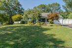 Come See This Beautiful Expanded Ranch home, with a 1 Bedroom 1 Full bathroom legal accessory apartment. The main house features 4 Bedrooms and 2 Full Bathrooms, Tile flooring/Laminate Flooring throughout. 2 Ductless Air Conditioners. Vaulted Ceilings, the home sits on a Half-acre Corner Lot, with a Huge PVC Fenced Backyard. Inground Swimming pool. Two sheds, Fenced side yard for the apartment. Double wide driveway. Inground sprinklers. A Fantastic Opportunity. Make this your New Happy Home