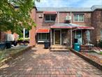 Welcome to this 2-bedroom townhouse featuring a full finished basement with a separate entrance â€” perfect for additional living space or a home office. Enjoy the convenience of an attached garage plus an additional rear parking space. The dining room opens directly to a private patio, ideal for relaxing or entertaining, while the updated front porch adds great curb appeal. With just a touch of TLC, this home can truly become your forever home.Located within walking distance of Juniper Valley Park for all your recreational activities, and offering easy transportation options into Manhattan, this property blends comfort, convenience, and potential in one great package.