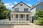 Welcome to this exquisite turn-of-the-century Colonial home, nestled on a tranquil street, offering a perfect blend of historic charm and modern luxury. This beautifully remodeled residence features new windows, heating and air conditioning systems, plumbing, electrical work, roof and gutter system. The inviting front porch welcomes you into a home where every detail has been thoughtfully considered.The kitchen and bathrooms have been transformed with custom cabinetry, elegant stone countertops, state-of-the-art appliances, and unique light fixtures, creating spaces that are both functional and stylish. Throughout the home, original hardwood floors and moldings have been meticulously preserved, enhancing the character of the flowing floor plan that is bathed in natural light.This three-bedroom, two-bathroom home is perfectly situated in a highly walkable neighborhood, just steps from the vibrant offerings of Beekman Avenue, including restaurants, retail shops, and minutes from the newly opened Decicco & Sons market. Families will appreciate the proximity to Morse Elementary School, while commuters will enjoy easy access to train stations for convenient access to the city in as little as 40 minutes. The nearby East Parcel development and the stunning Hudson waterfront provide additional attractions and amenities.A full-sized attic and a walkout basement offer ample storage and potential for a bonus room, while off-street parking adds convenience. The property is zoned for multi-family use, and architectural plans for an addition are available, offering endless possibilities for customization. This turnkey home is a rare find, combining timeless elegance with modern upgrades in a prime location.