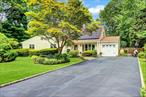 Welcome to this beautifully maintained 4-bedroom expanded ranch offering the perfect blend of comfort, function, and future potential. Step inside to find an updated eat-in kitchen featuring sleek stainless-steel appliances, tall cabinetry for exceptional storage, and gorgeous granite countertops. The spacious layout flows seamlessly into a large open living room and a bonus space that can serve as a formal dining room or cozy denâ€”ideal for entertaining or everyday living.The primary bedroom includes a convenient half bath, 3 additional bedroom with ample closet space, and an updated hall bathroom with walk-in shower and sliding glass doors. A walk-up attic offers incredible potential for converting into additional living space, an office, or a den. Ductless air conditioning system. Outside, enjoy a fenced, landscaped yard with a private patio, perfect for relaxing or gatherings. One car garage with laundry. Recent updates add even more value, including a newer roof (6 years), energy-efficient leased solar panels (just 2 years old), updated 200-amp electric service. Comsewogue school district. This home combines style, functionality, and efficiencyâ€”ready for you to move in and make it your own.