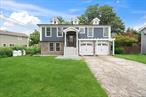 UTILITIES INCLUDED! Immaculate and freshly painted, this hi-ranch with 3 bedrooms, kitchen and dining room has it all! Gas heat, central air conditioning, deck and manicured yard - spacious and serene.