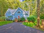 Nestled on a full acre of beautifully landscaped grounds, this 3-bedroom, 2-bath home offers timeless charm with thoughtful updates. Built in 1984, the property is bordered on one side by state land, providing rare privacy and a natural setting that&rsquo;s sure to appeal to those seeking peace and a connection to the outdoors.A dramatic 24-foot cathedral-ceiling foyer with wood flooring throughout welcomes you inside, setting the tone for the home&rsquo;s rustic elegance. The sunlit eat-in kitchen features hand-painted tiles, butcher block counters, recessed lighting, and stained glass accents, a perfect blend of artistry and functionality. The open dining and living area, complete with beamed ceilings and a wood-burning fireplace, creates an inviting space for gatherings.Upstairs, a cozy sitting area with built-in bookshelves makes an ideal reading nook, while the primary suite is a true retreat with its skylight and Romeo & Juliet balcony overlooking the grounds. Outdoor living is equally inviting, with lush landscaping, a bluestone patio and a brick outdoor oven perfect for entertaining or enjoying quiet evenings at home.All this just 5 minutes to Kingston and only 10 minutes to Woodstock or Saugerties, offering the perfect balance of tranquility and convenience. This home is truly a must see